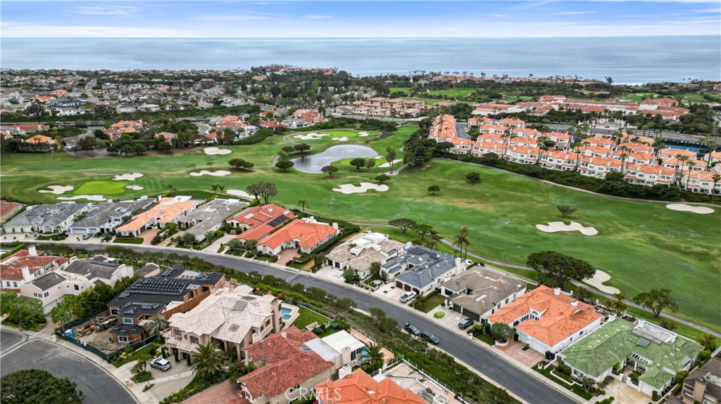 27 Marbella Dana Point, CA 92629 - Photo 66 of 66 an aerial view of a city with lots of residential buildings ocean and mountain view in back