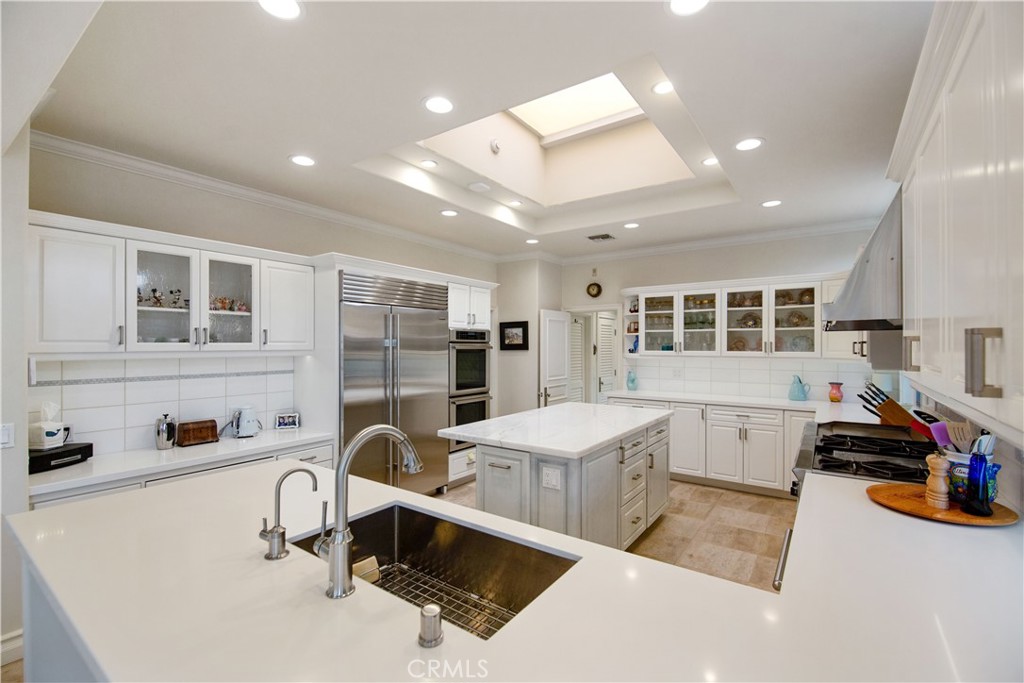 27 Marbella Dana Point, CA 92629 - Photo 10 of 66 a living room with furniture a table and kitchen view