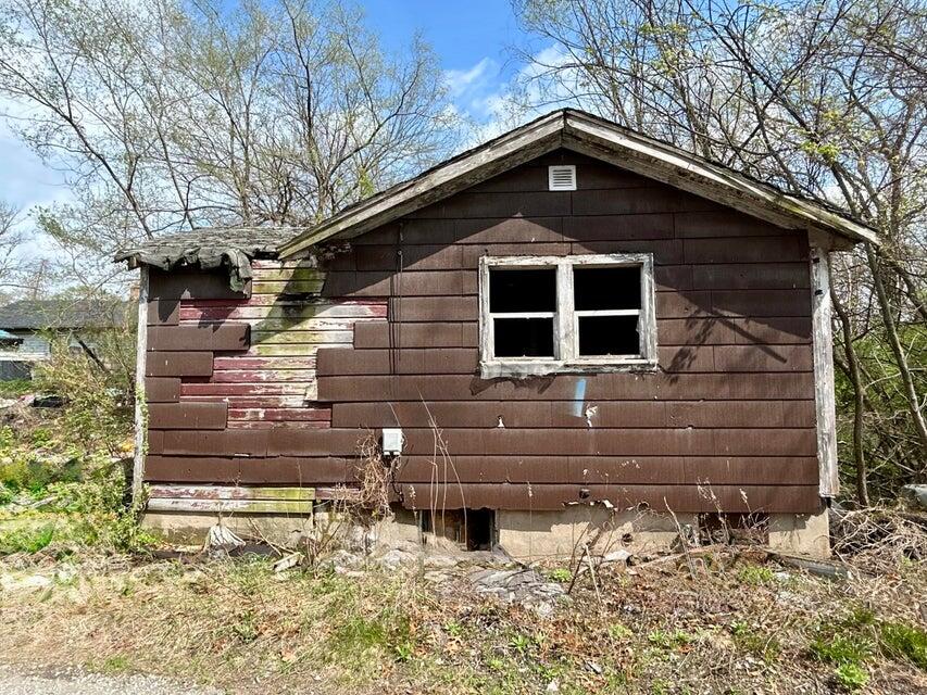 4036 Johnson Street Gary, IN 46408 - Photo 2 of 2 a front view of a house with a yard