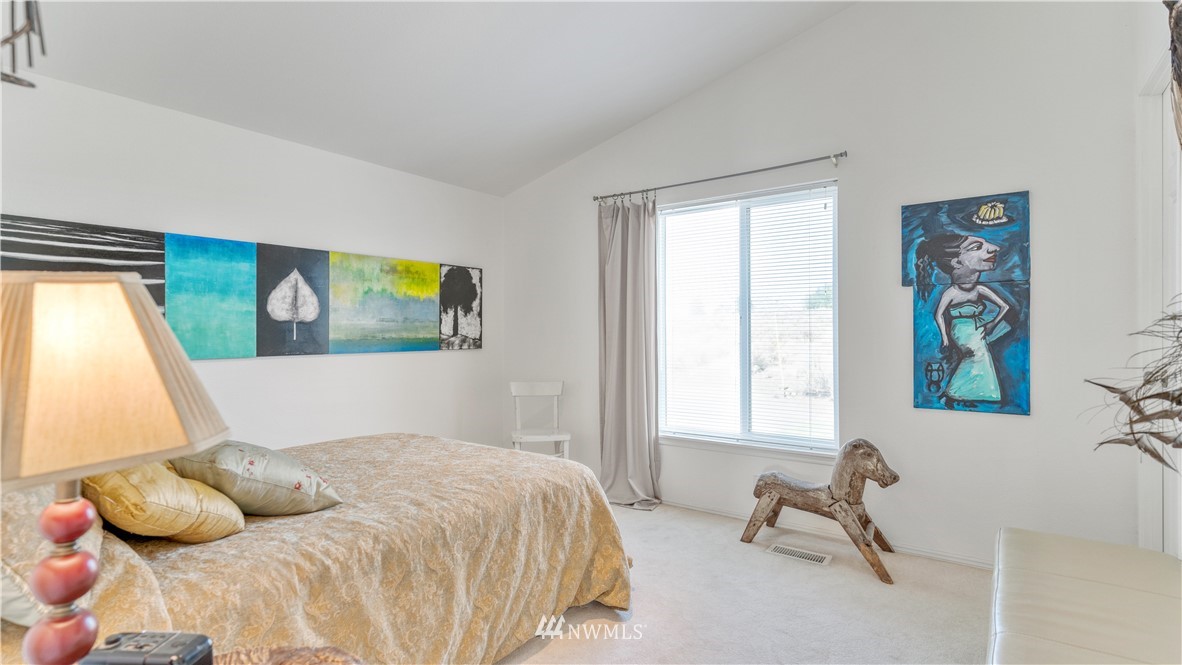 175118 West Byron Road Prosser, WA 99350 - Photo 18 of 36 a bedroom with a bed and a window