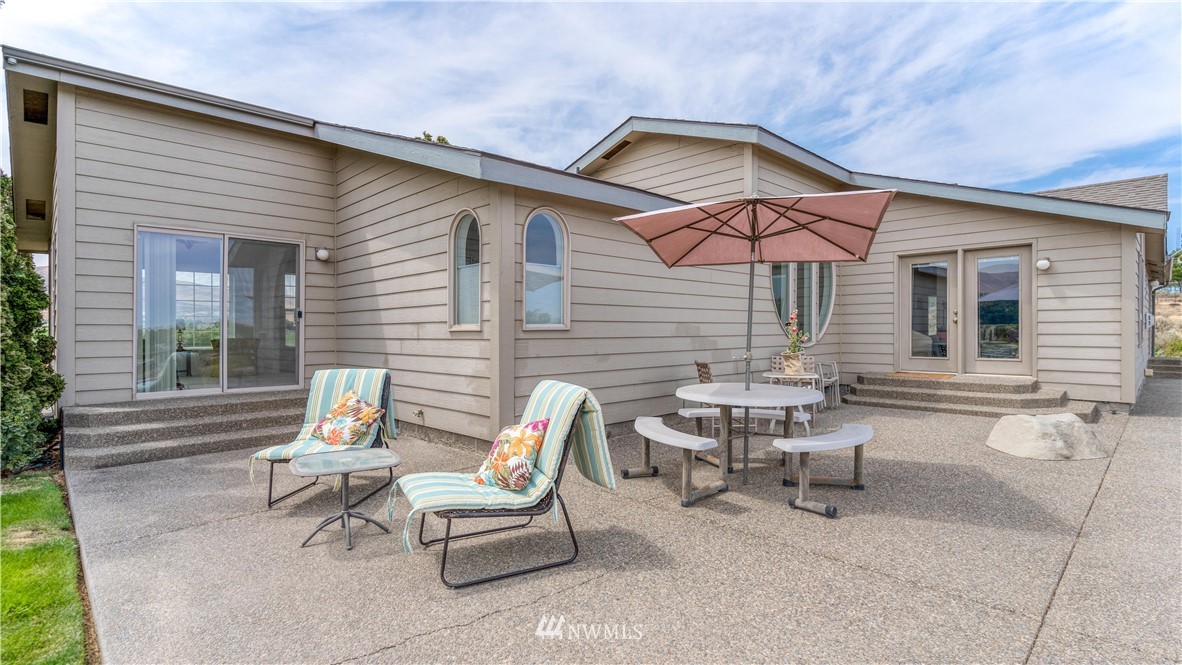 175118 West Byron Road Prosser, WA 99350 - Photo 25 of 36 a view of a patio with a table and chairs under an umbrella