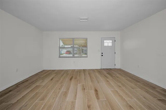 a view of a livingroom with wooden floor