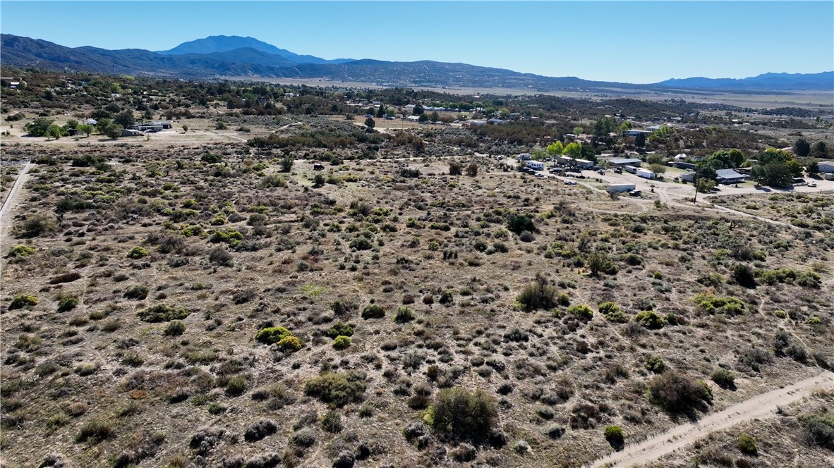 4 Old Forest Road Anza, CA 92539 - Photo 5 of 8 a view of a lush green hillside and houses