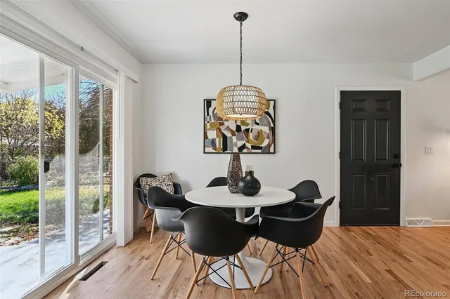 a dining room with furniture and window