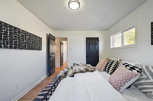 a bedroom with bed and a window