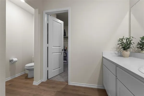 a bathroom with a sink a toilet and a shower