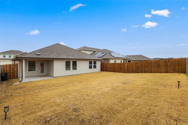 a house with yard in front of it