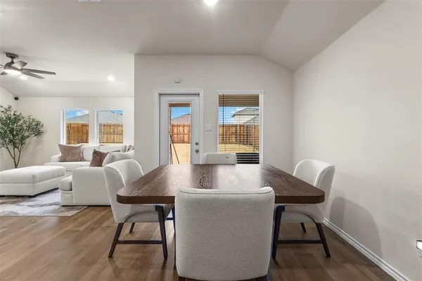 a view of a dining room with furniture and window