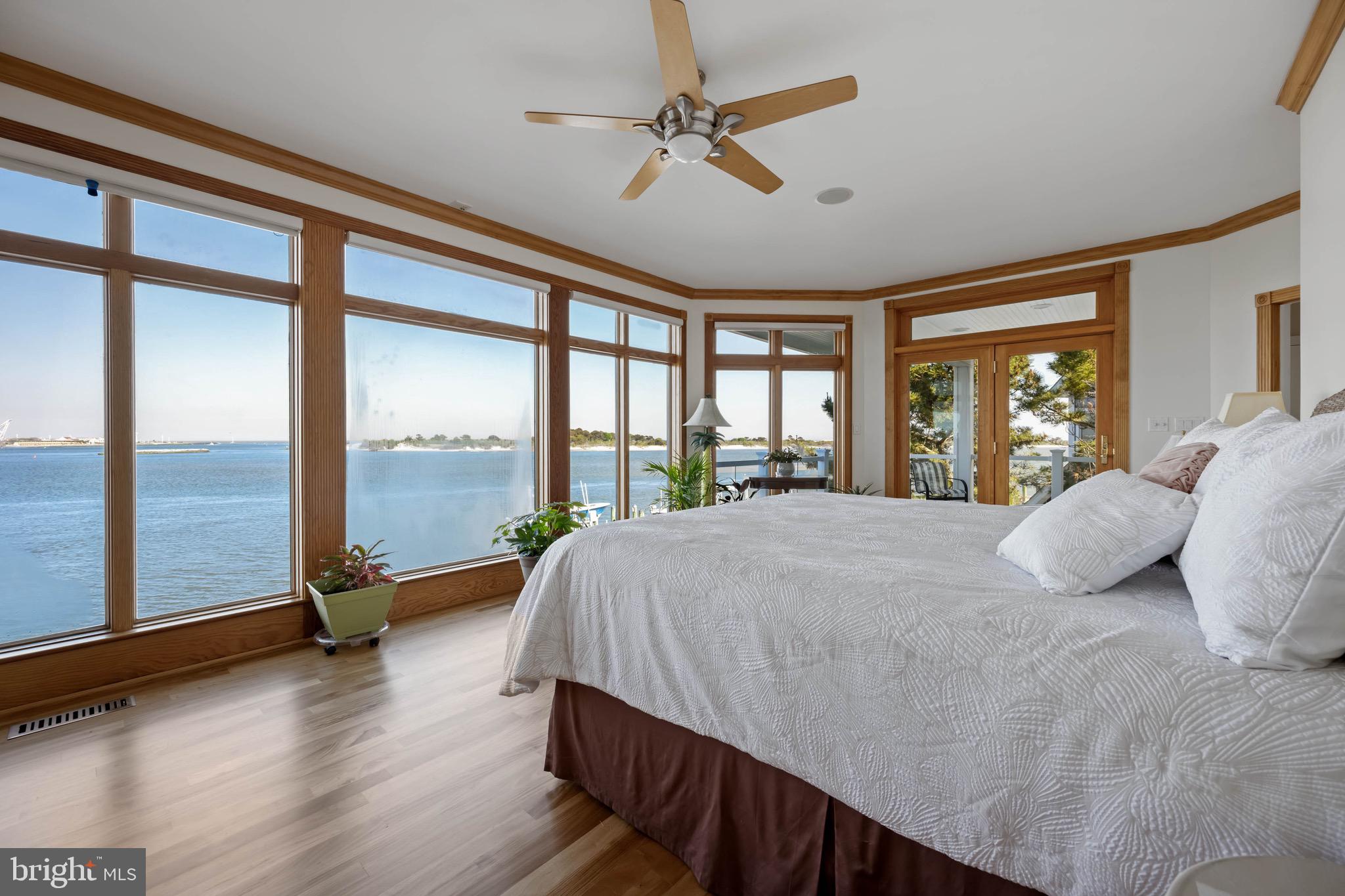 12959 Harbor Road Ocean City, MD 21842 - Photo 24 of 85 a bedroom with a large bed and a large window