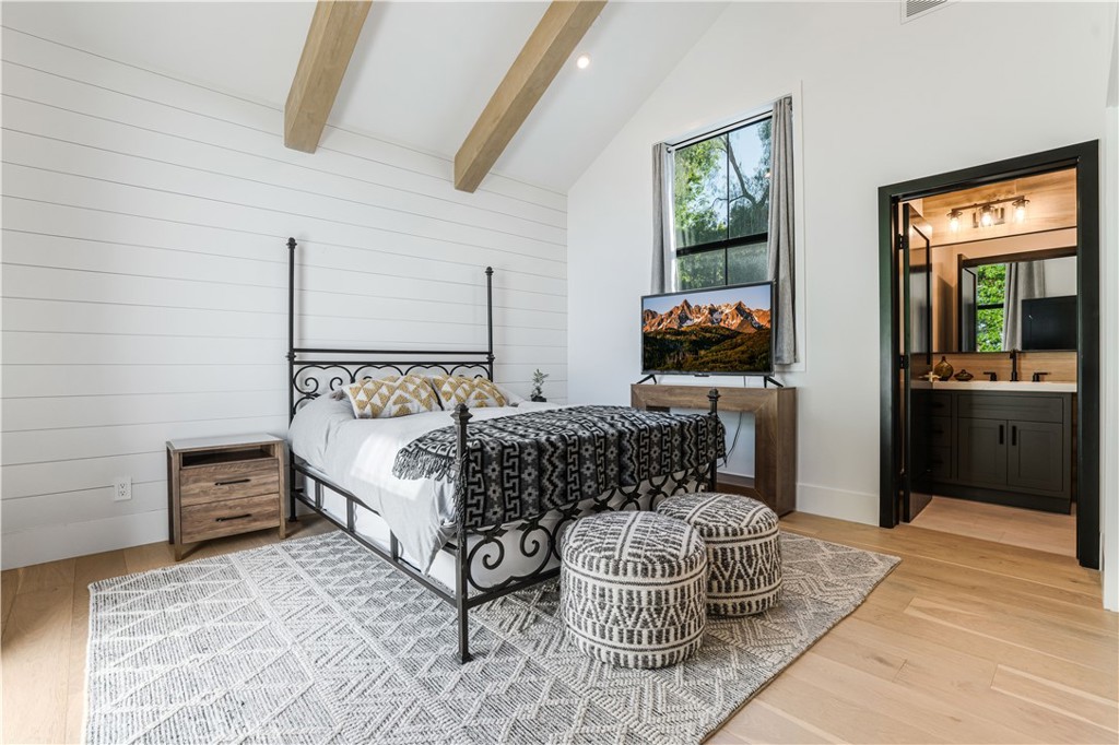 14614 Round Valley Drive Sherman Oaks, CA 91403 - Photo 16 of 35 a bedroom with a bed and wooden floor