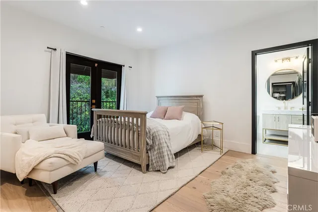 a bed room with a bed and a television