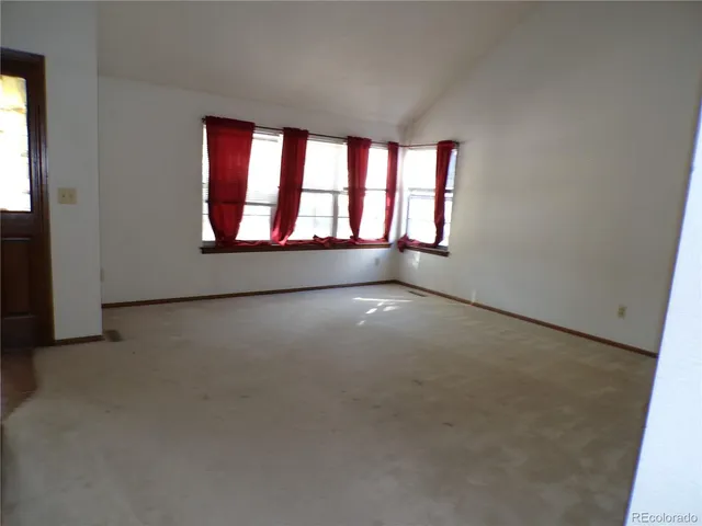 a view of an empty room and window