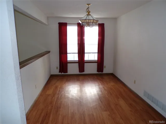 a kitchen with a refrigerator and a sink