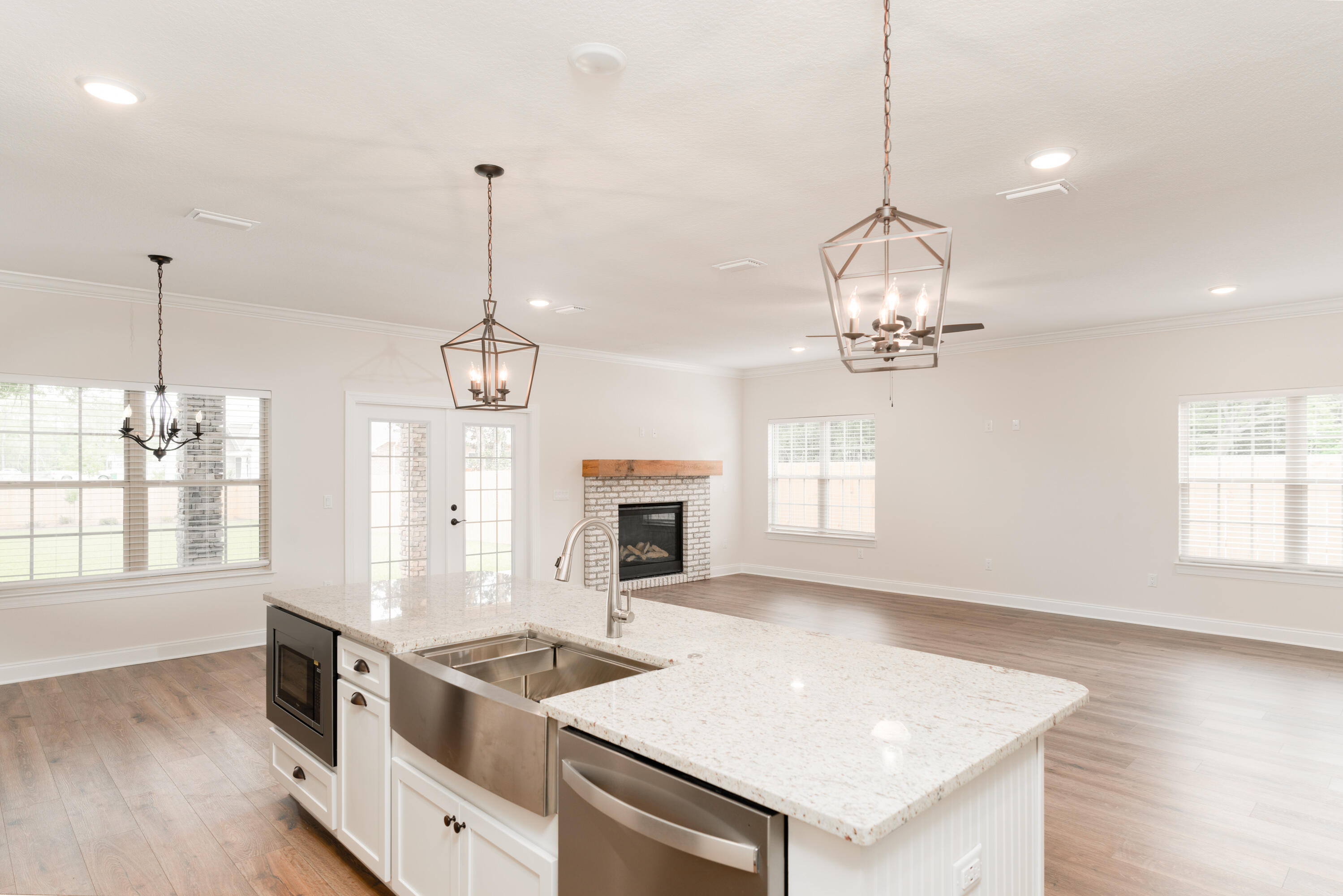 1184 Forest Heights Road Fort Walton Beach, FL 32547 - Photo 11 of 45 a kitchen that has a lot of cabinets and wooden floor