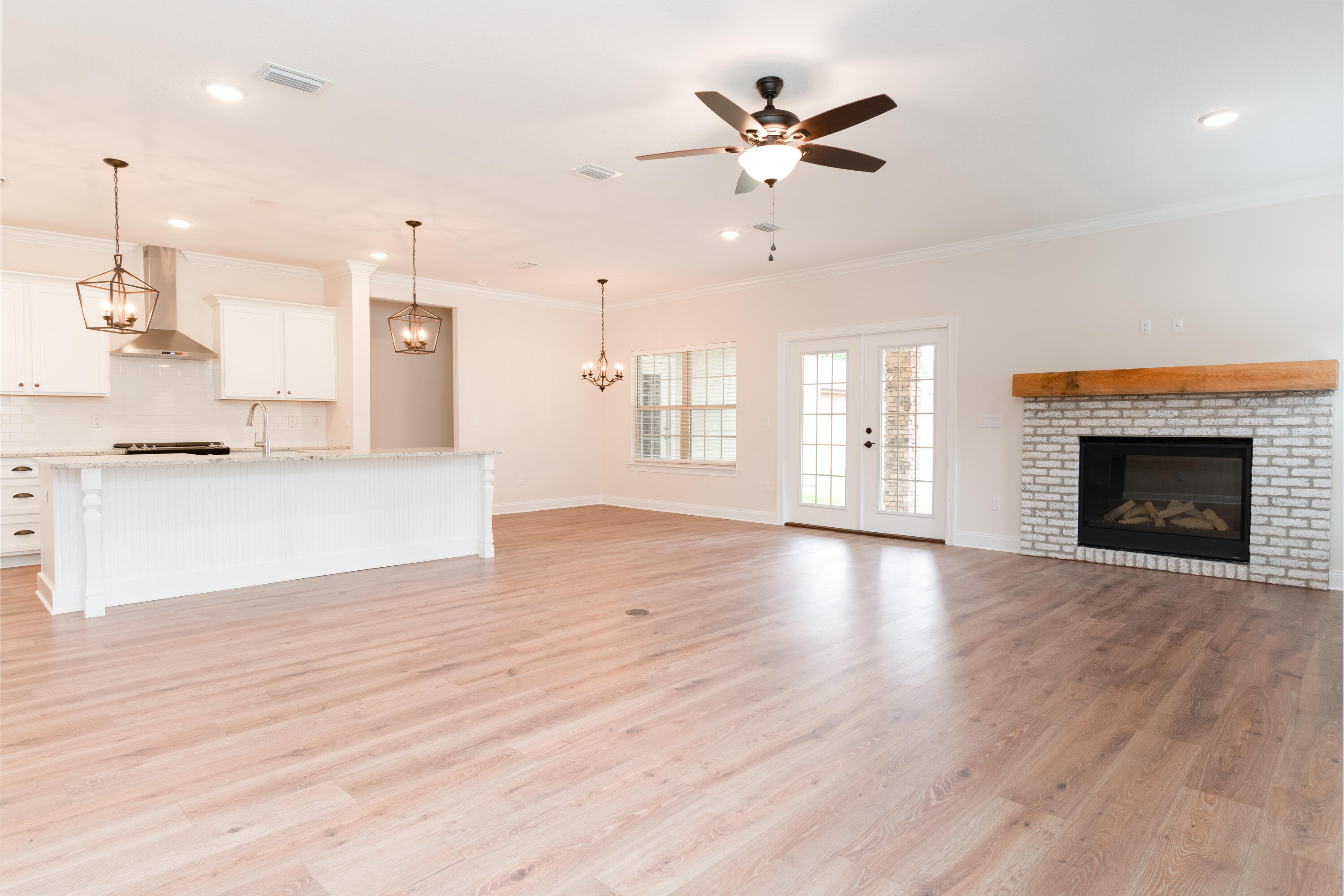 1184 Forest Heights Road Fort Walton Beach, FL 32547 - Photo 13 of 45 a view of a kitchen with a sink and a fireplace
