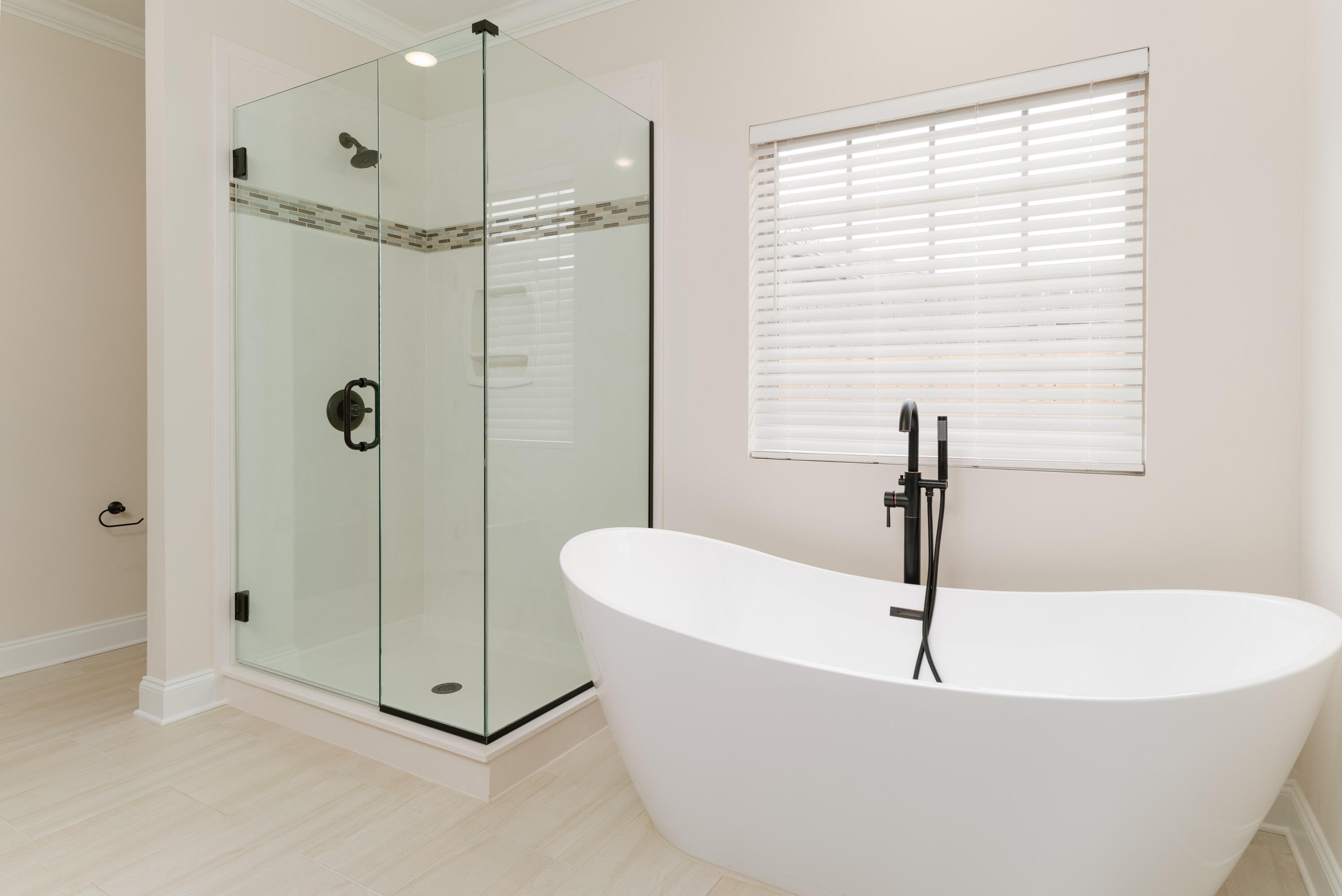 1184 Forest Heights Road Fort Walton Beach, FL 32547 - Photo 16 of 45 a white bath tub sitting next to a shower