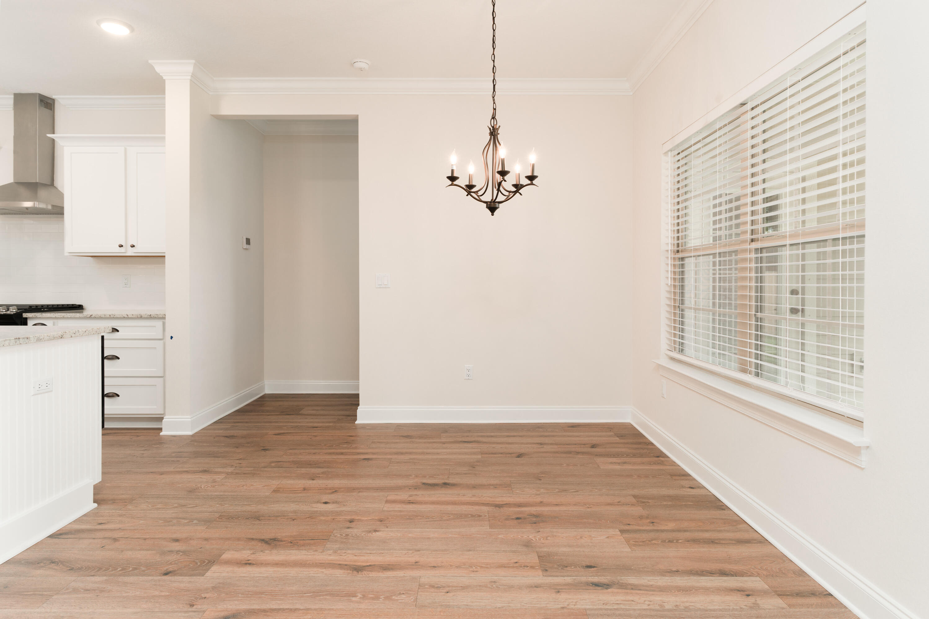 1184 Forest Heights Road Fort Walton Beach, FL 32547 - Photo 19 of 45 a view of empty room with wooden floor and fan