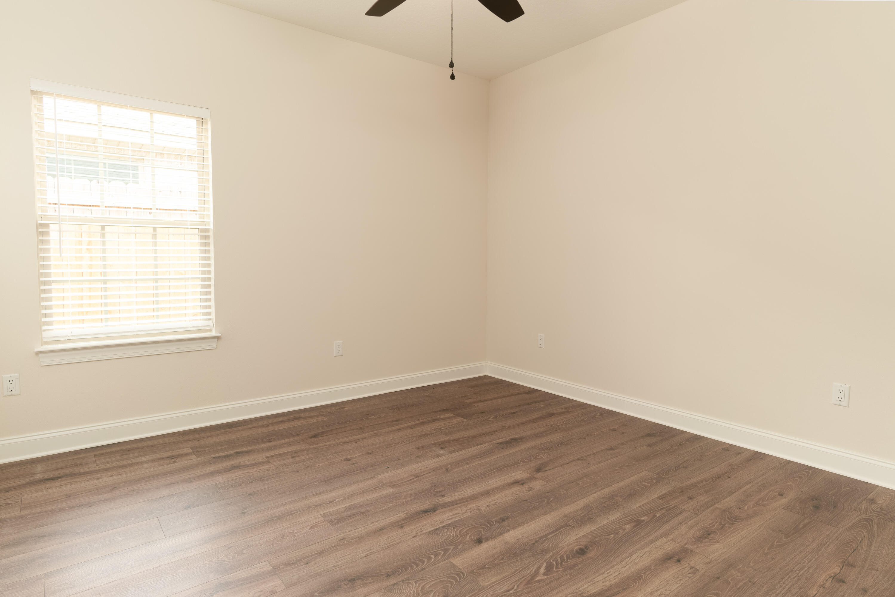 1184 Forest Heights Road Fort Walton Beach, FL 32547 - Photo 22 of 45 an empty room with wooden floor and windows