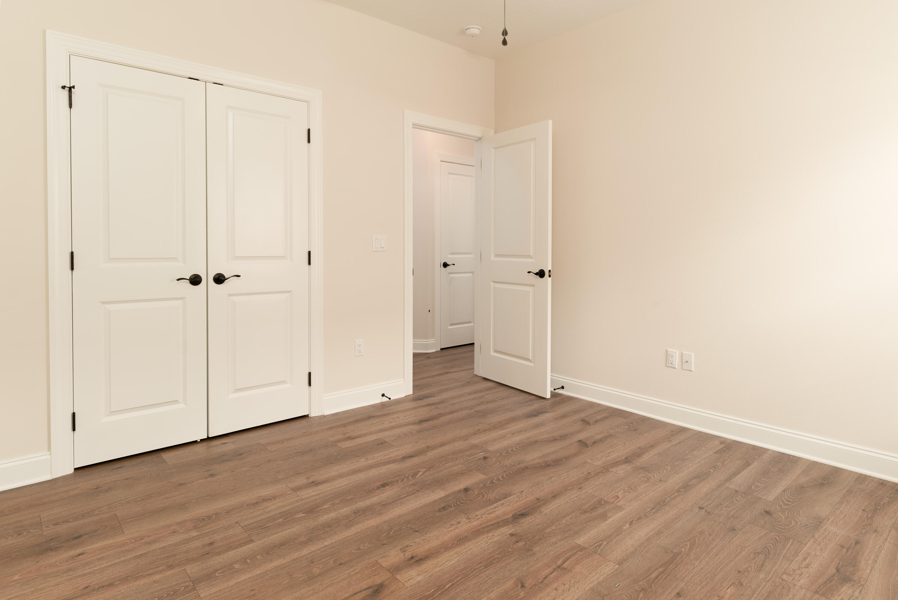 1184 Forest Heights Road Fort Walton Beach, FL 32547 - Photo 23 of 45 a view of an empty room with wooden floor