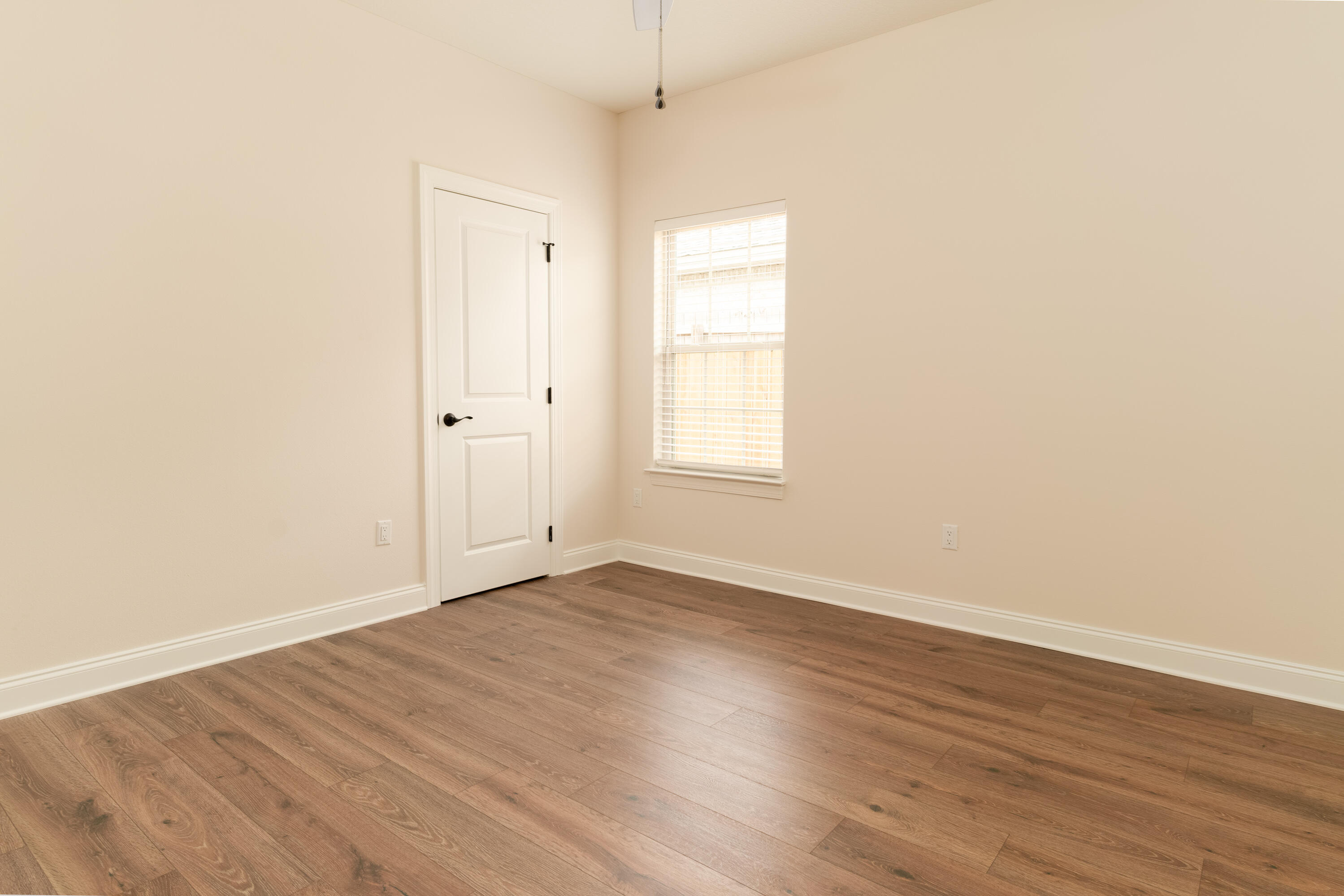 1184 Forest Heights Road Fort Walton Beach, FL 32547 - Photo 24 of 45 an empty room with wooden floor and windows