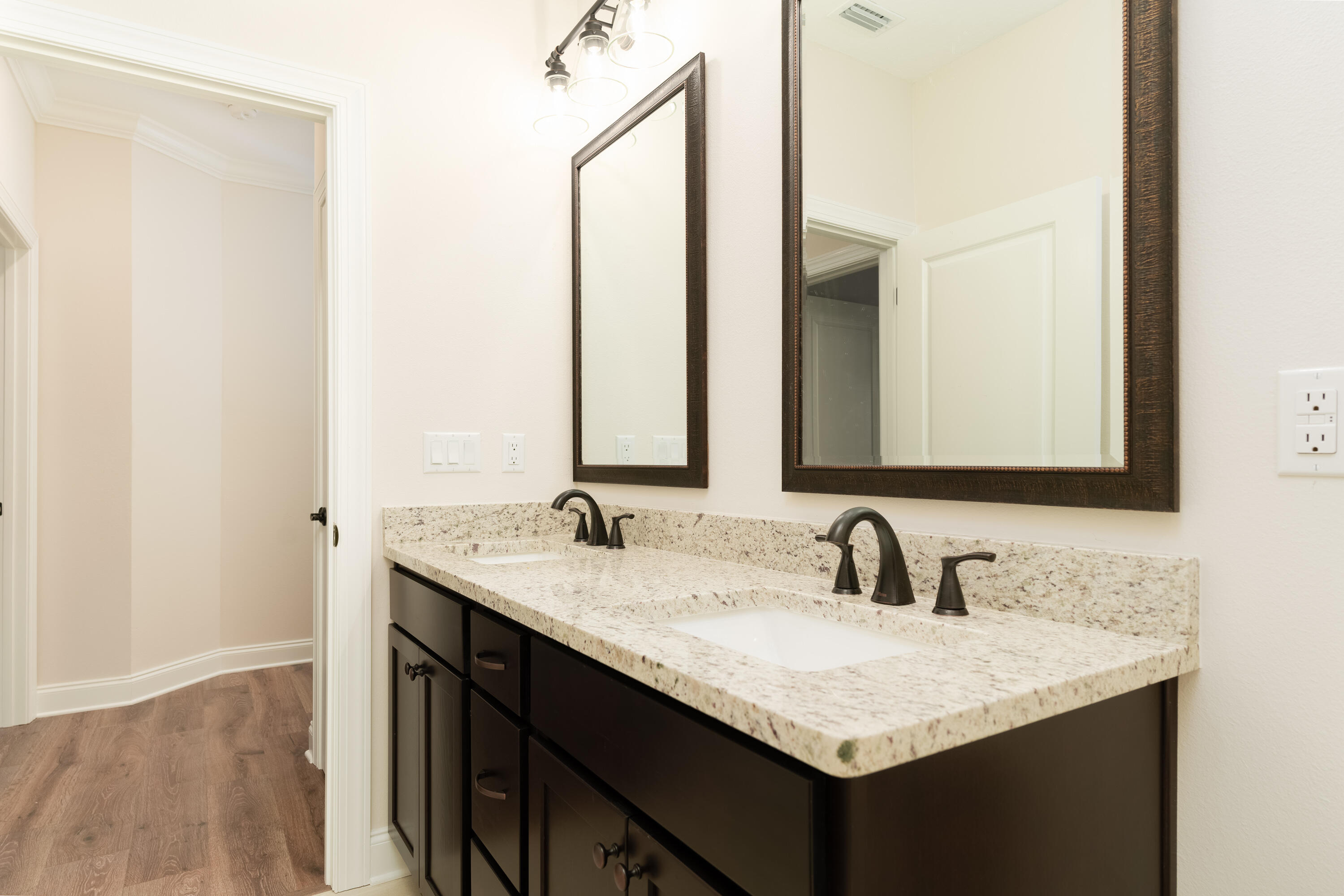 1184 Forest Heights Road Fort Walton Beach, FL 32547 - Photo 25 of 45 a bathroom with a granite countertop sink and a mirror