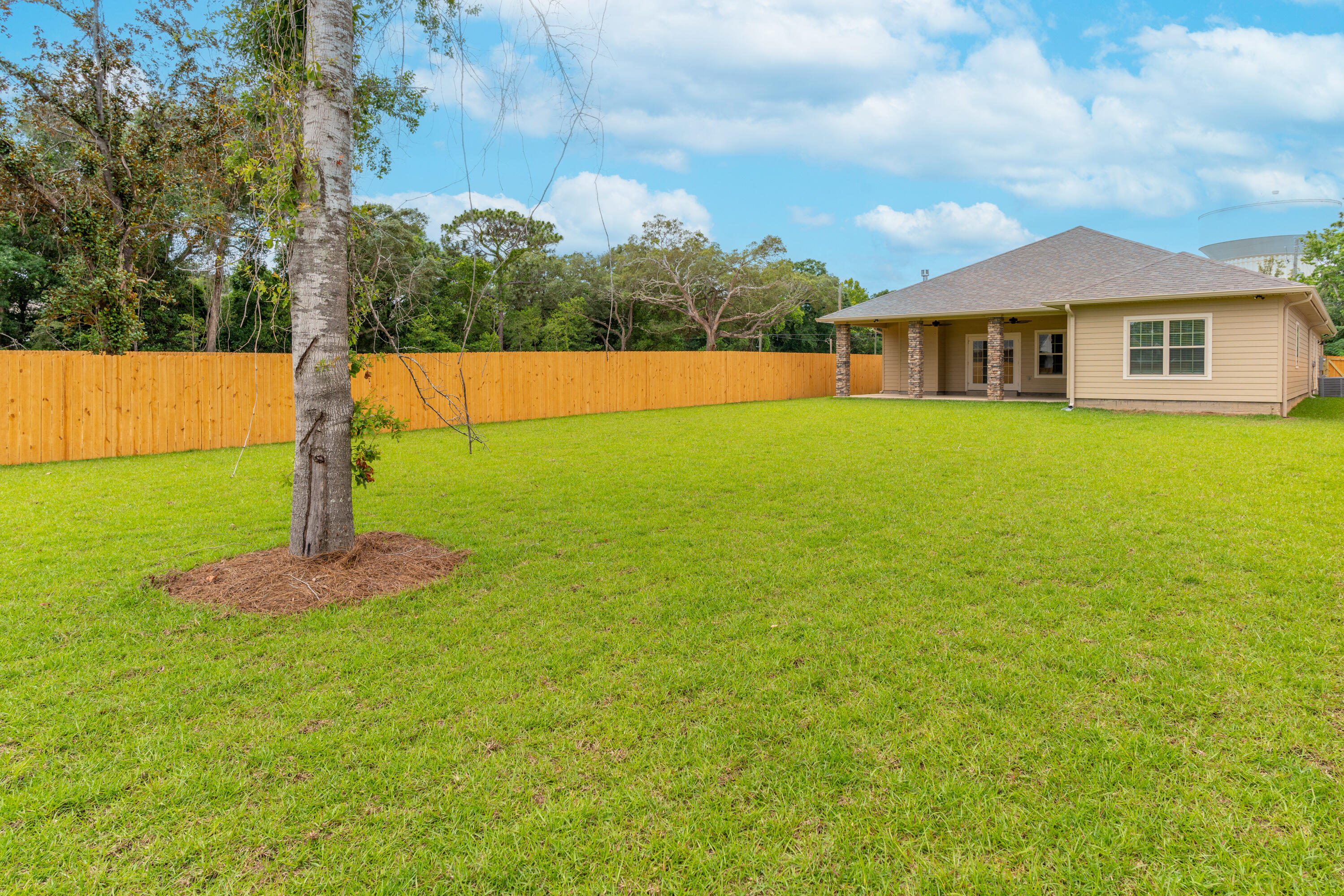 1184 Forest Heights Road Fort Walton Beach, FL 32547 - Photo 29 of 45 a front view of a house with a yard