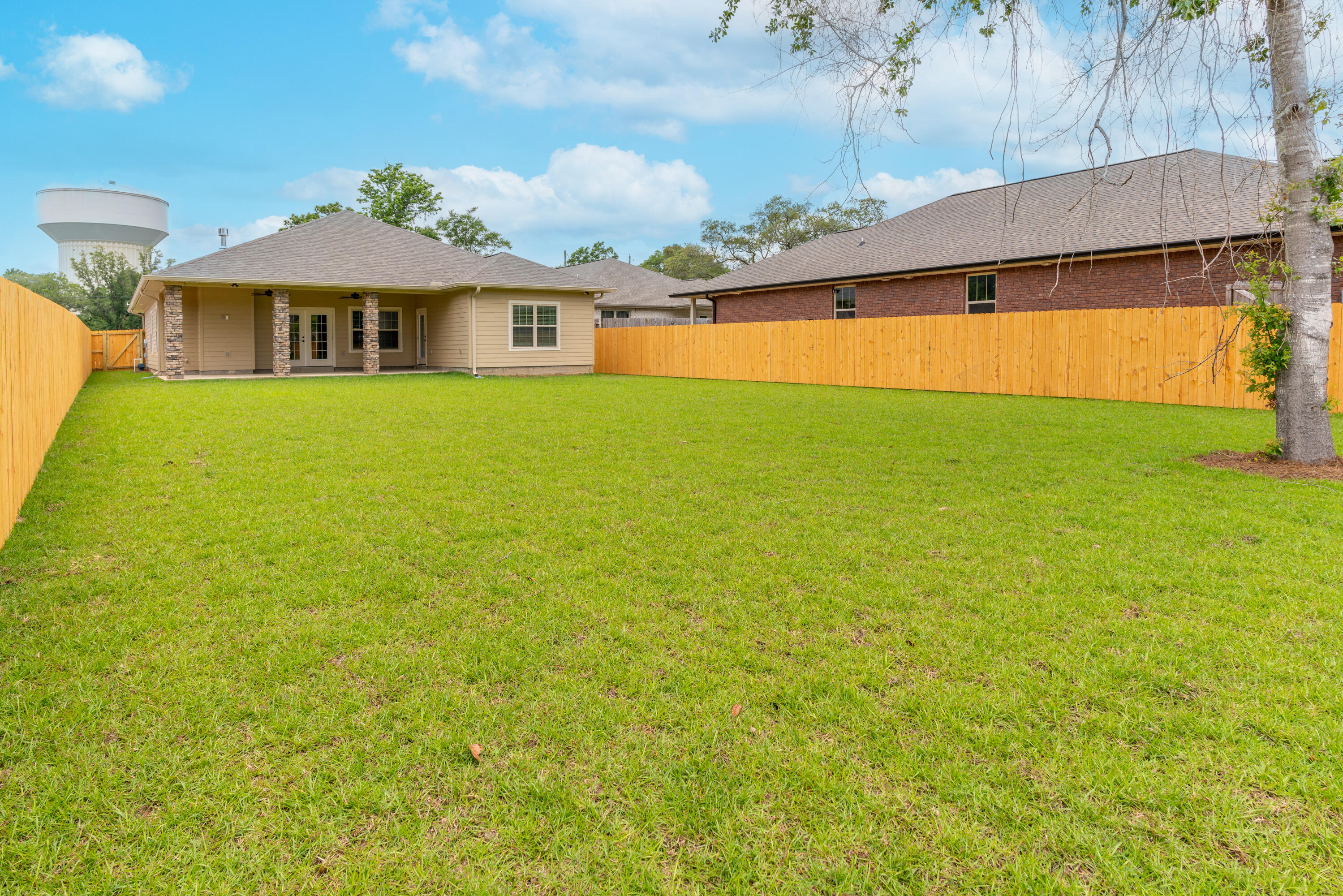 1184 Forest Heights Road Fort Walton Beach, FL 32547 - Photo 34 of 45 a front view of a house with a big yard