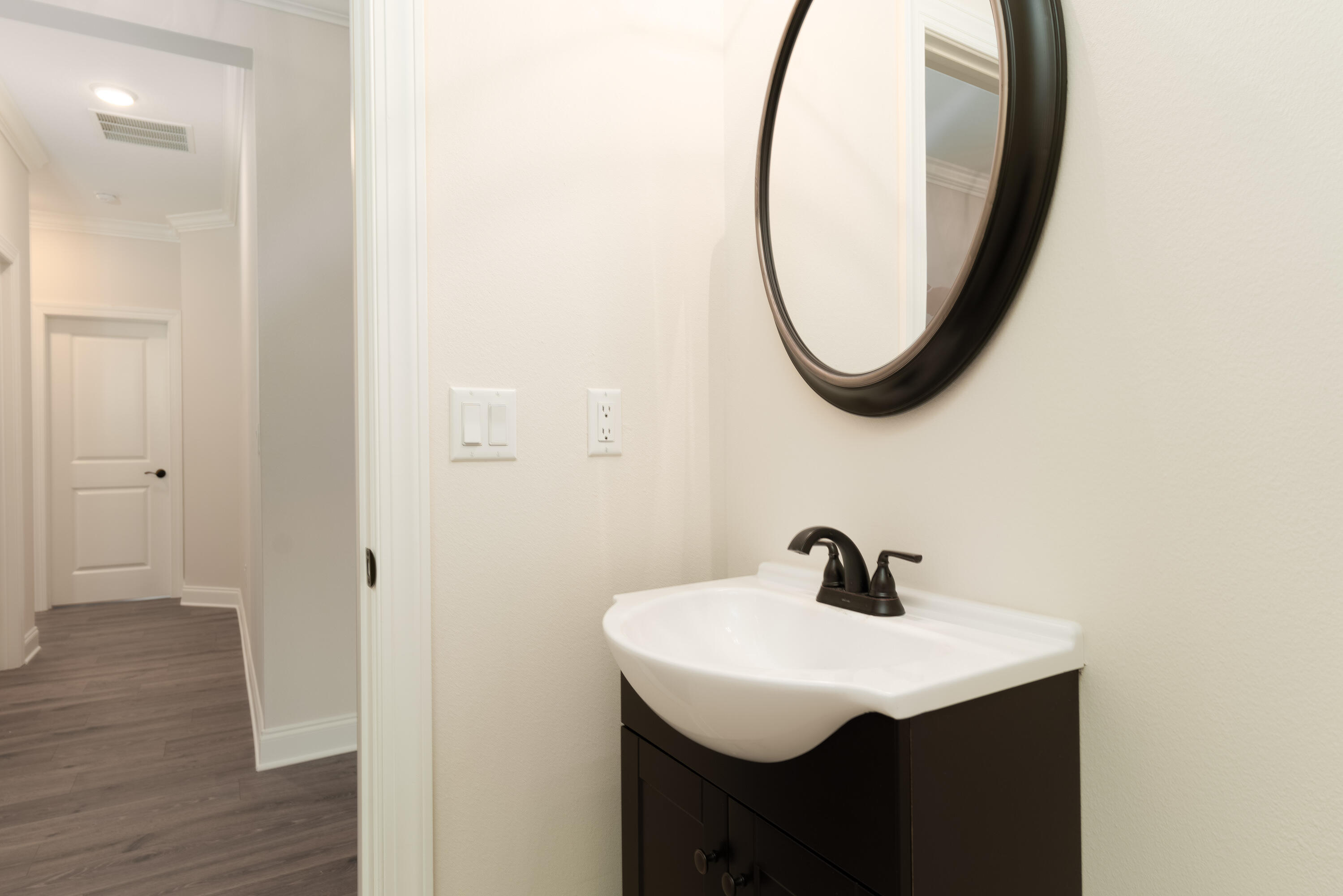1184 Forest Heights Road Fort Walton Beach, FL 32547 - Photo 4 of 45 a bathroom with a sink and a mirror