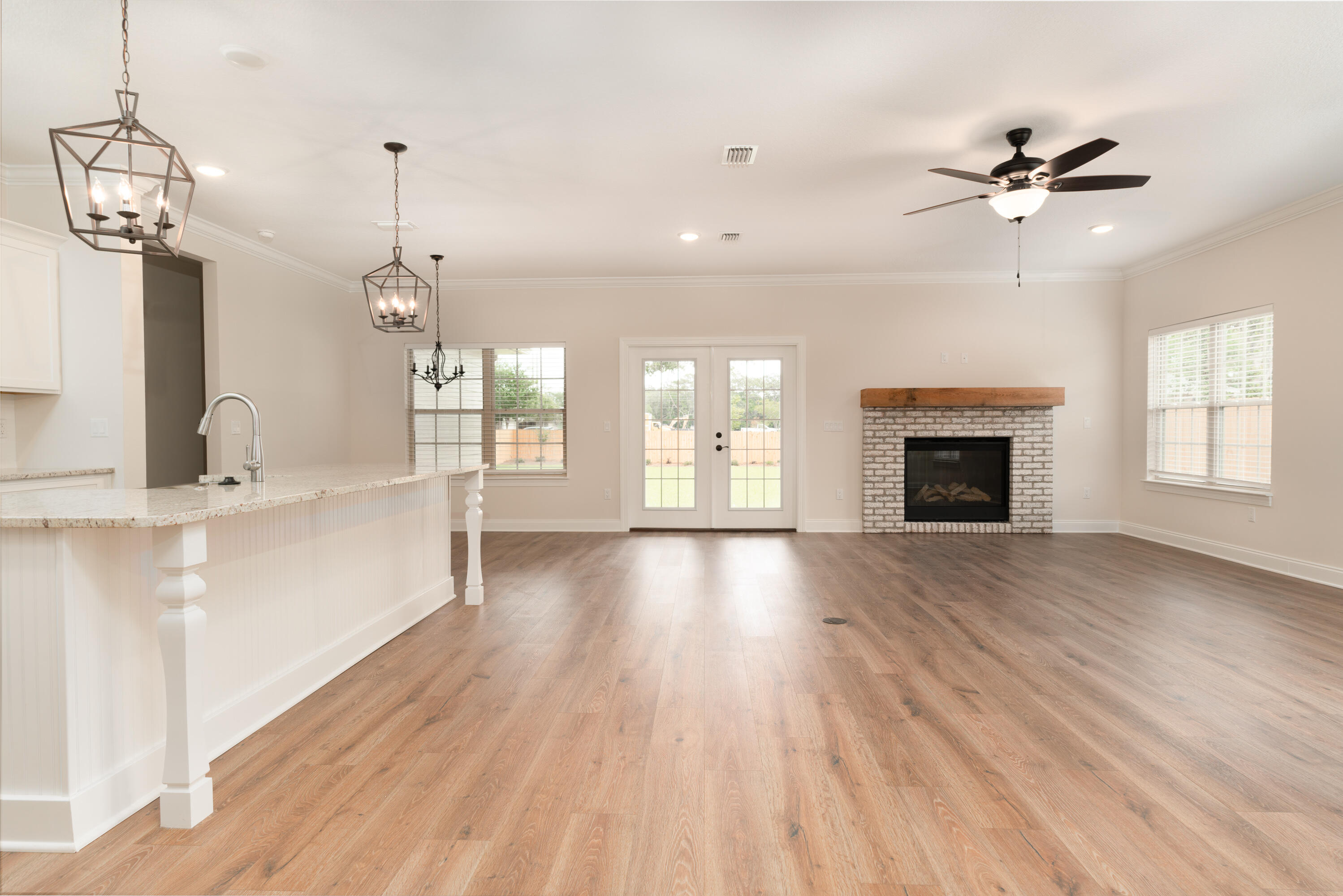 1184 Forest Heights Road Fort Walton Beach, FL 32547 - Photo 7 of 45 a view of an empty room with a fireplace and a window
