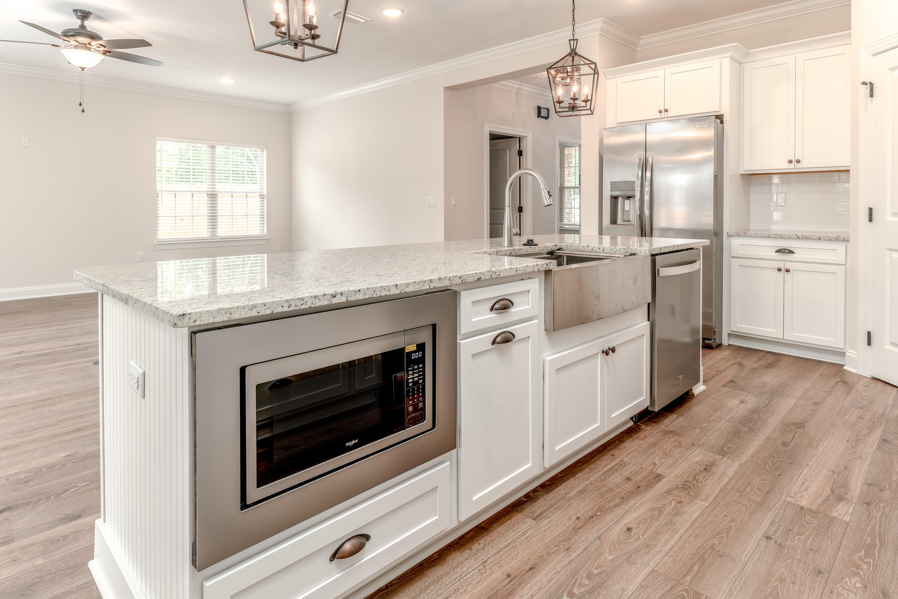 1184 Forest Heights Road Fort Walton Beach, FL 32547 - Photo 9 of 45 a kitchen with stainless steel appliances granite countertop a stove a sink and a refrigerator