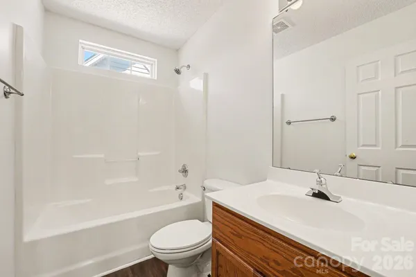 a bathroom with a sink a toilet and a bathtub