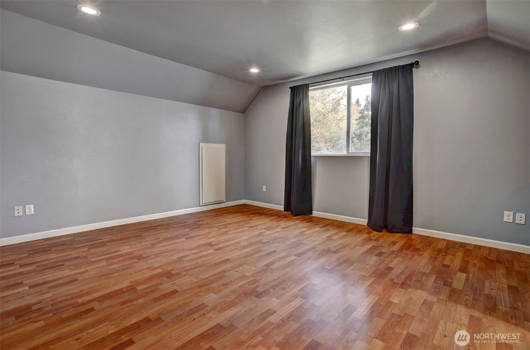 35904 Southeast 46th Street Fall City, WA 98024 - Photo 11 of 20 a view of empty room with wooden floor and fan