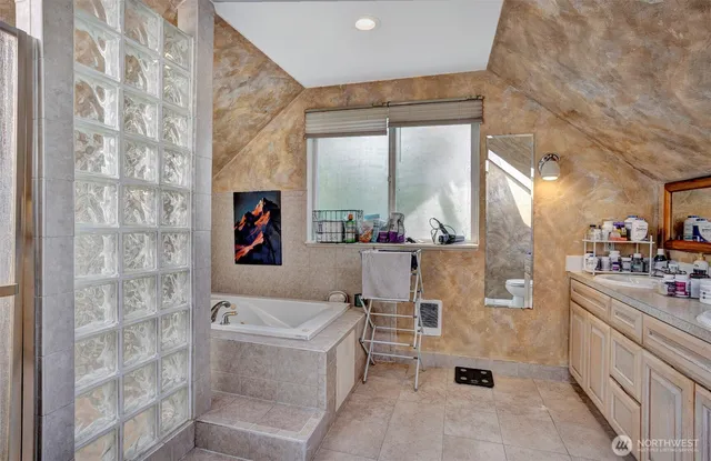 a bathroom with a bathtub and a sink