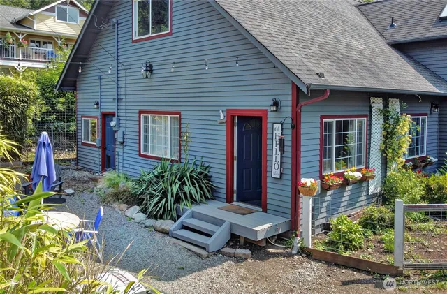 a front view of a house with garden