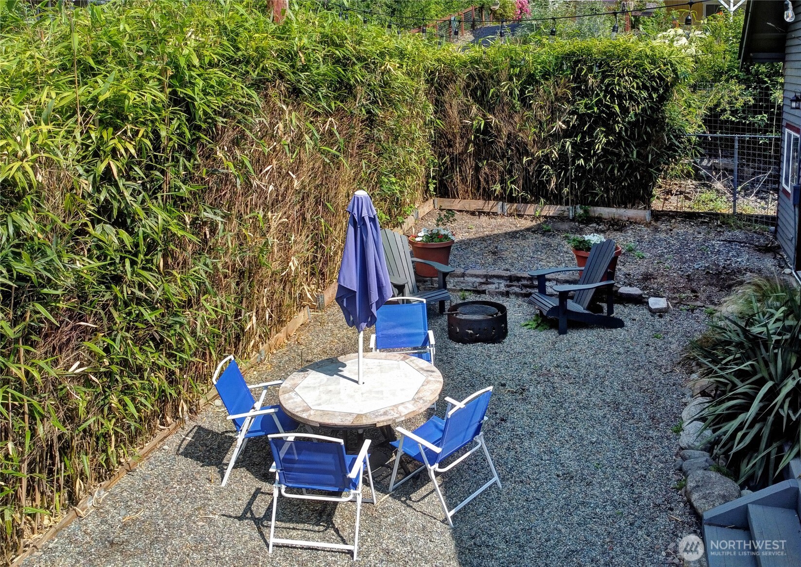 35904 Southeast 46th Street Fall City, WA 98024 - Photo 18 of 20 a backyard of a house with table and chairs