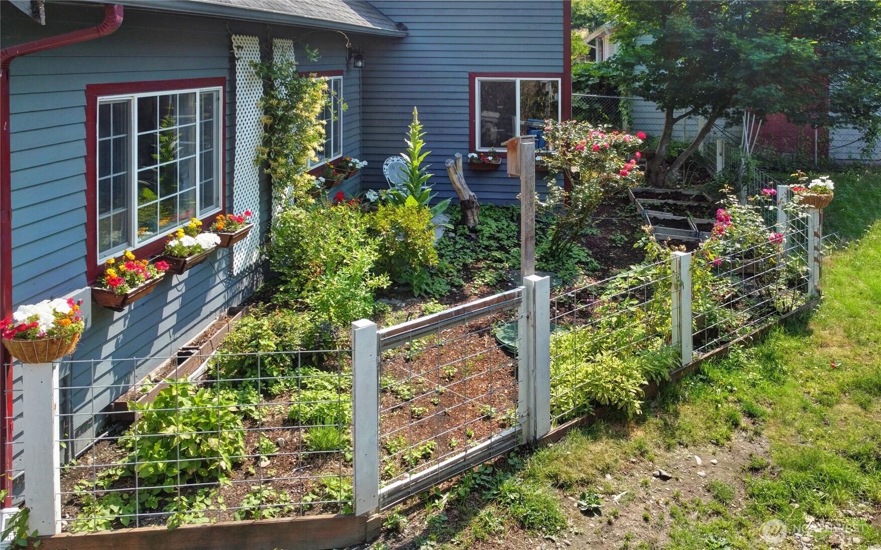 35904 Southeast 46th Street Fall City, WA 98024 - Photo 19 of 20 front view of a house with a flower garden