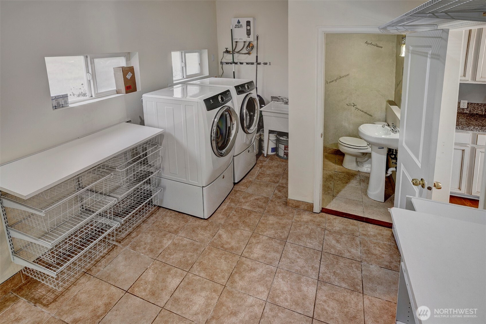 35904 Southeast 46th Street Fall City, WA 98024 - Photo 9 of 20 a view of a storage & utility room with washer and dryer