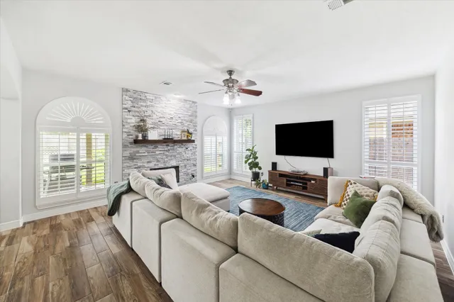 a living room with furniture and a flat screen tv
