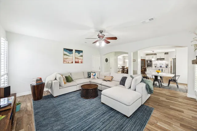 a living room with furniture or couch and a wooden floor