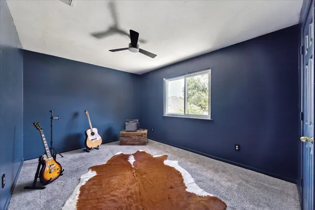a bedroom with bed and window
