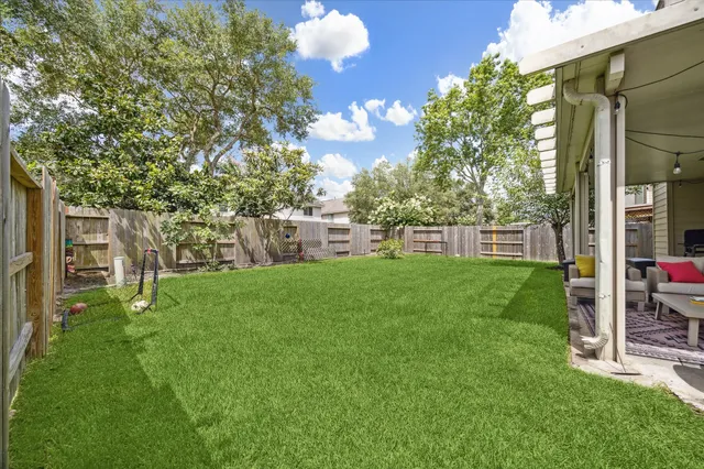a view of a house with a backyard