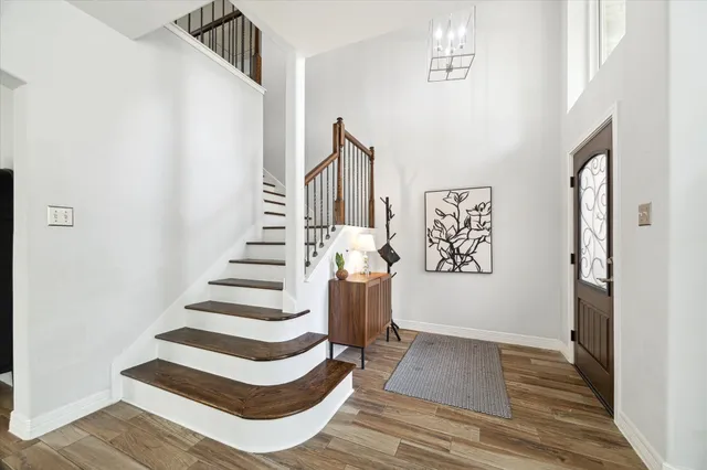 a view of entryway with stairs and wooden floor