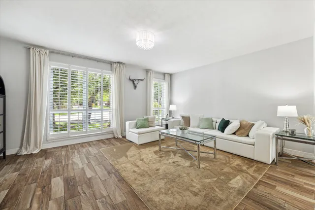 a living room with furniture and a large window