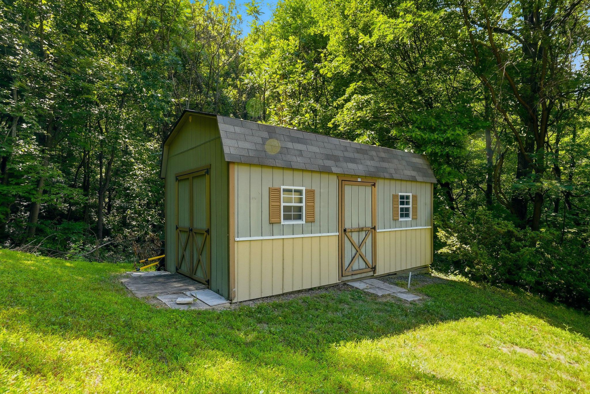 2411 Quaker Run Road Syria, VA 22743 - Photo 45 of 56 Charming shed nestled in lush greenery.