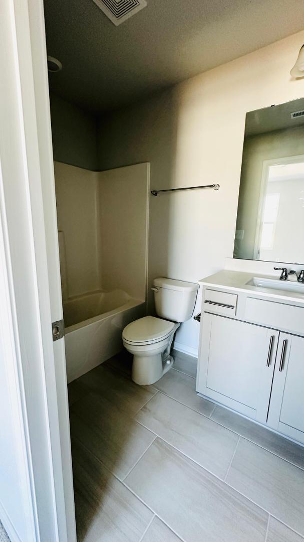 114 Red Brush Way Apex, NC 27539 - Photo 15 of 22 a bathroom with a toilet and a sink