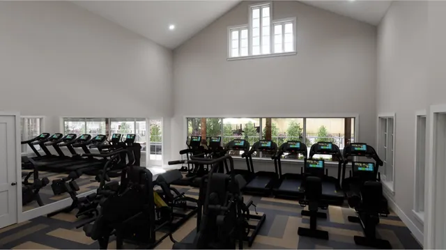 a view of a room with gym equipment window and chairs