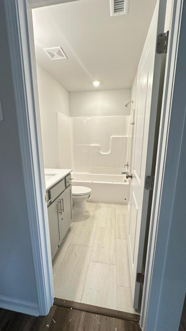 114 Red Brush Way Apex, NC 27539 - Photo 5 of 22 a bathroom with a sink and a toilet