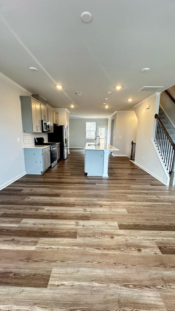 114 Red Brush Way Apex, NC 27539 - Photo 6 of 22 a large kitchen with stainless steel appliances lots of counter top space