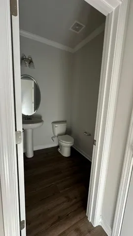 a bathroom with a toilet and a sink