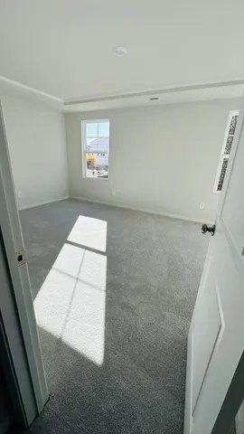 a view of an empty room and window